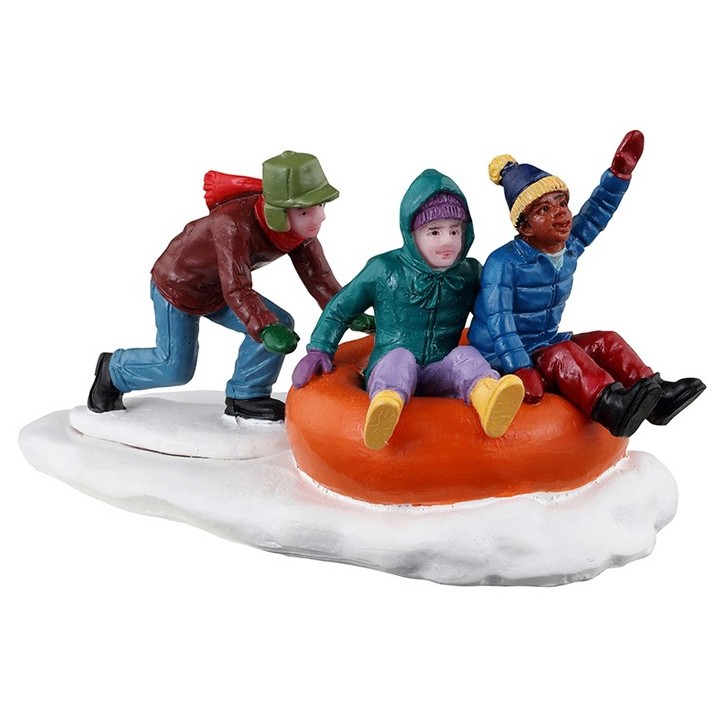 Enfants et bouée sur neige Lemax