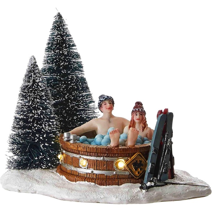 Couple dans jacuzzi enneigé lumineux LUVILLE